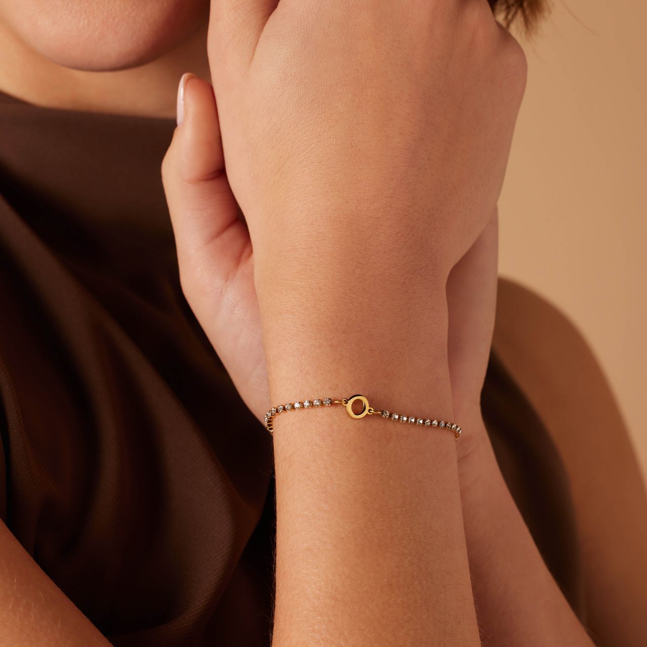 Stainless steel goldplated tennis armband wit cz letter - O