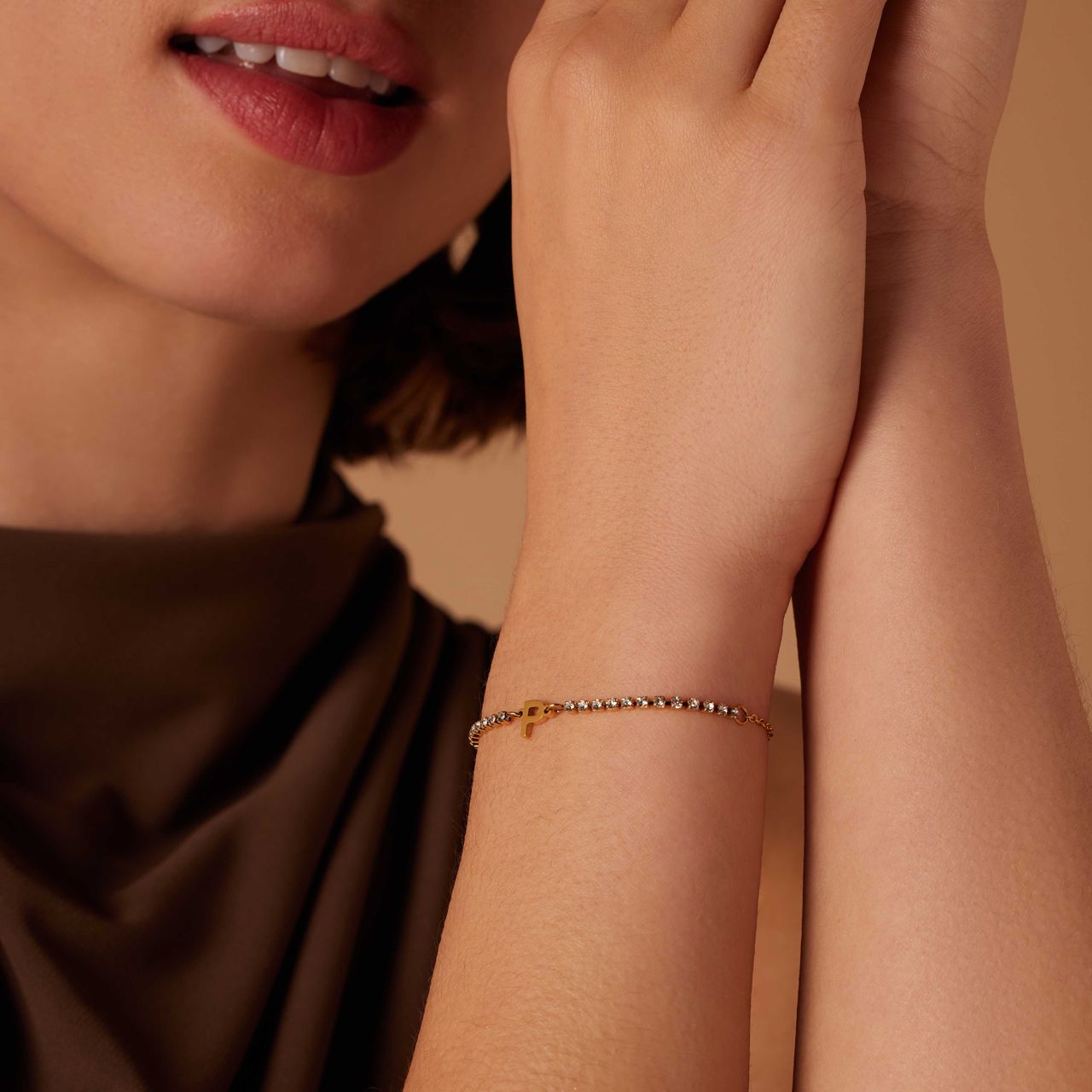 Stainless steel goldplated tennis armband wit cz letter - P