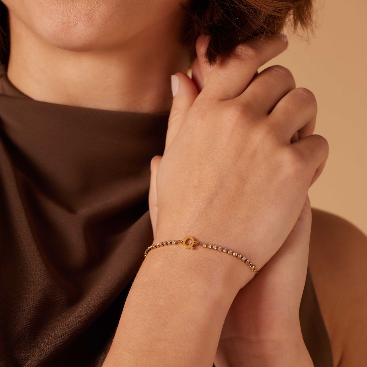 Stalen goldplated tennis armband wit cz letter - Q