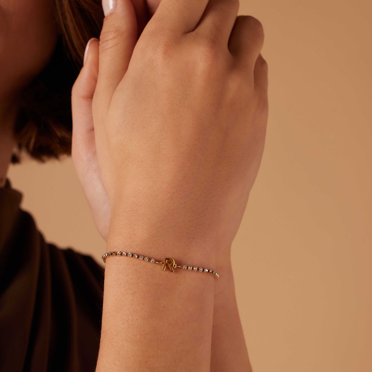 Stalen goldplated tennis armband wit cz letter - R