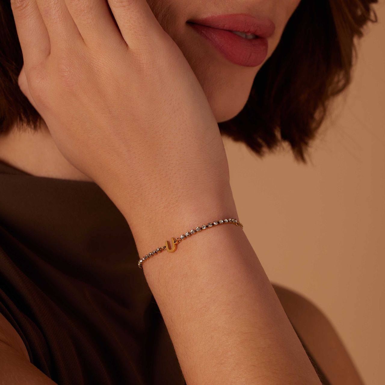Stalen goldplated fantasiearmband met letterhanger U met zirkonia voor dames