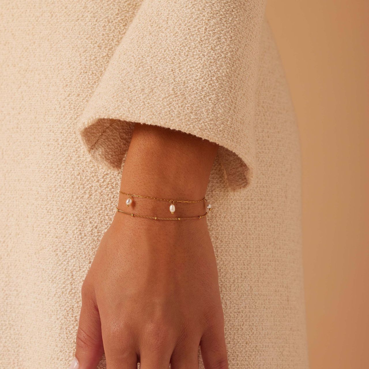 Stainless steel goldplated armbandenset met parel