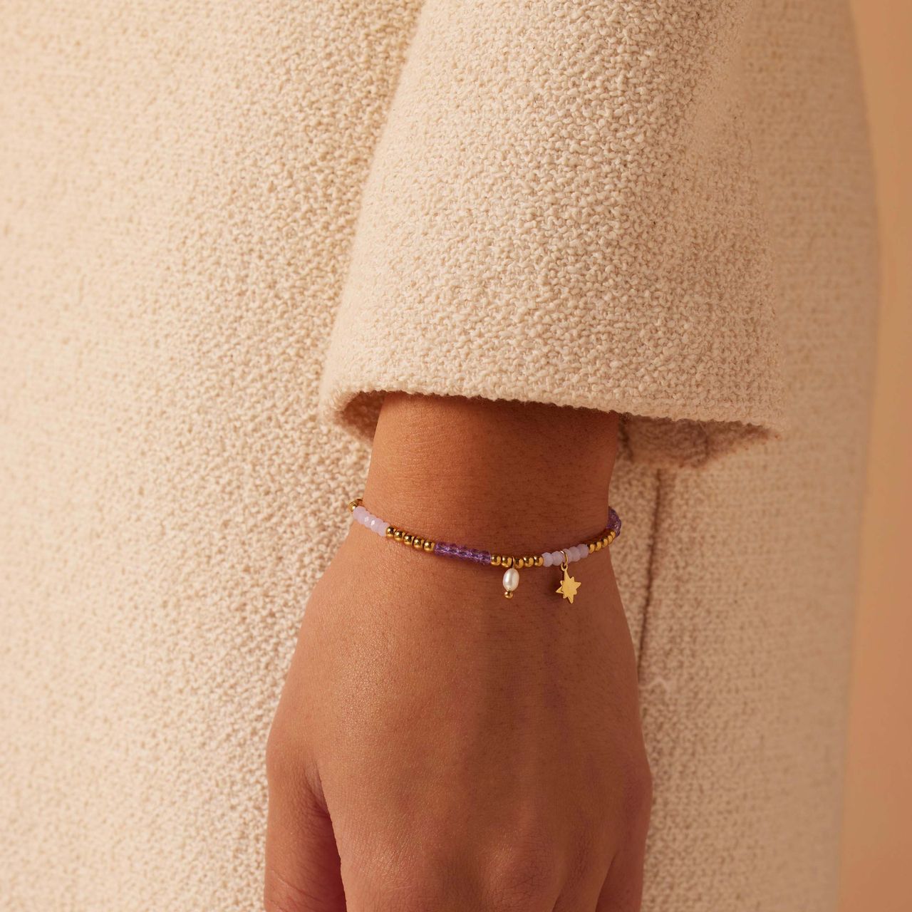 kralenarmband met parel en staal goldplated ster