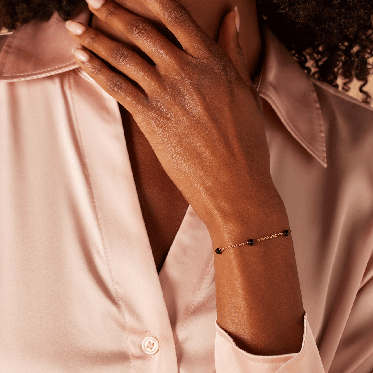 Stainless steel goldplated fantasiearmband met zwart agaat voor dames