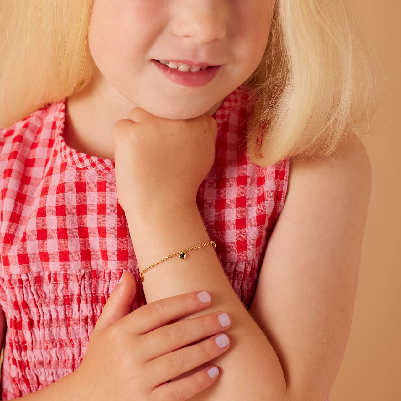 Zilveren goldplated kinderbedelarmband met hanger hart