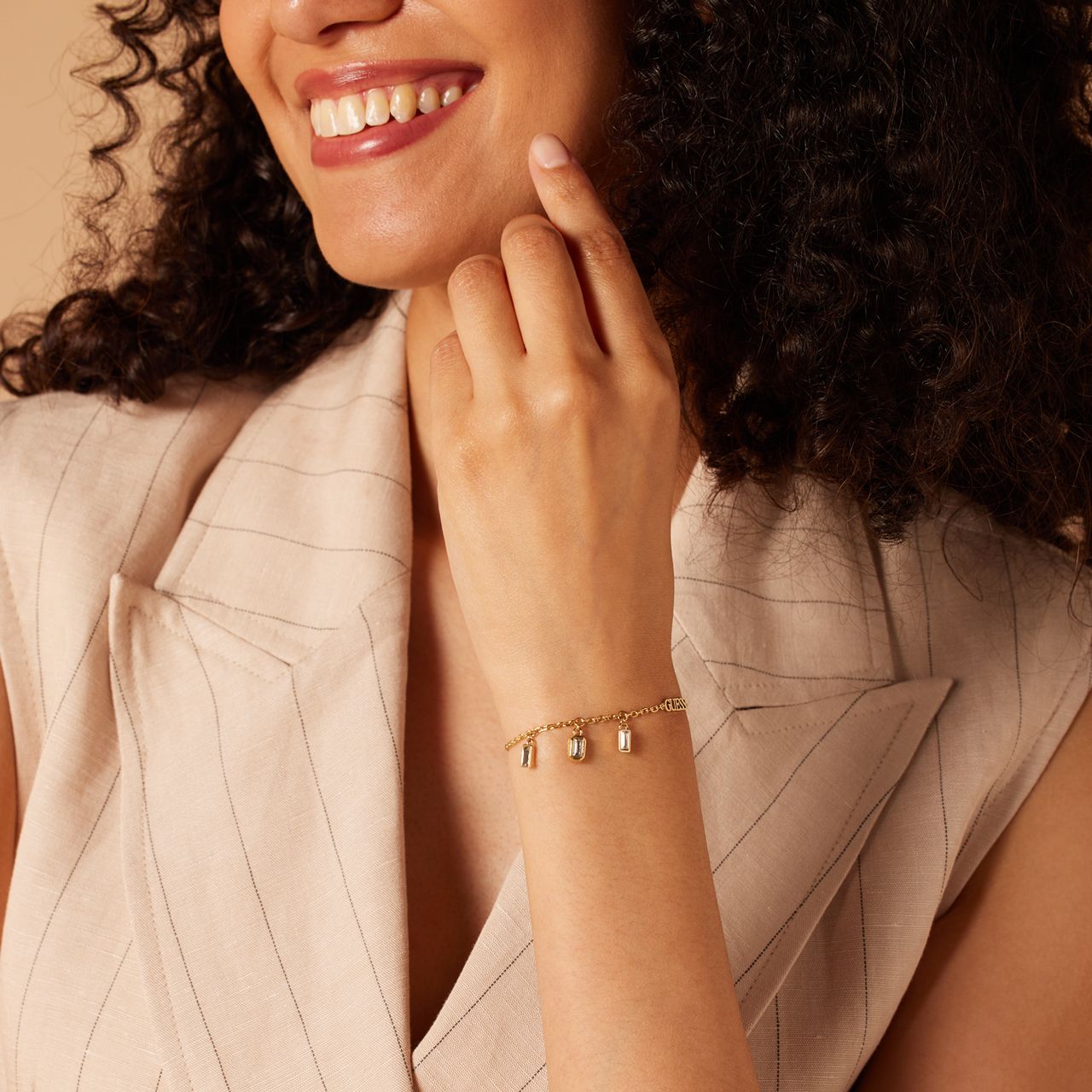Guess stainless steel goldplated fantasiearmband met zirkonia voor dames