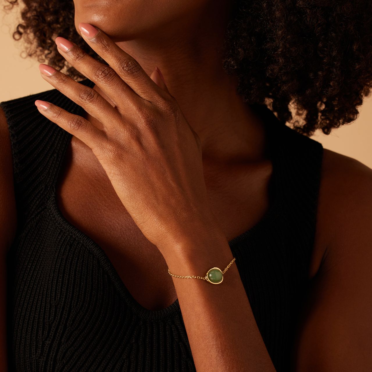 Stainless steel goldplated armband met groen aventurijn ovaal