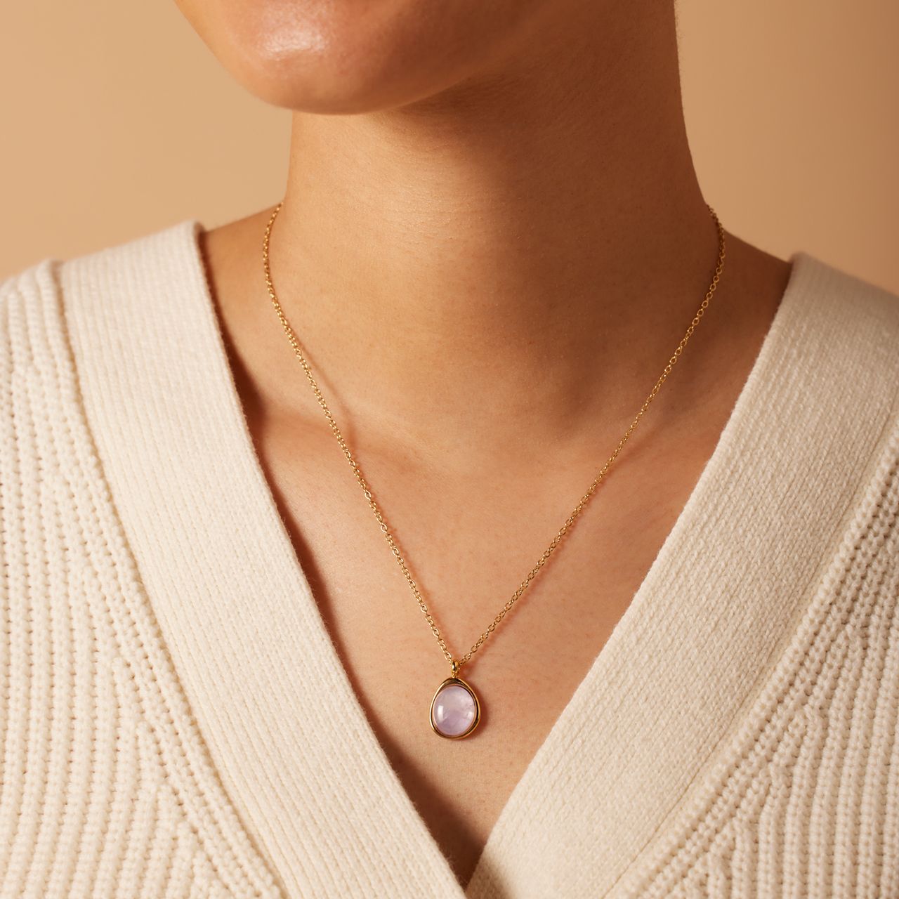 Stainless steel goldplated ketting met amethyst ovaal