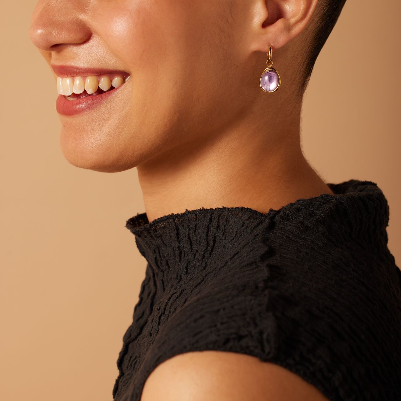 Stainless steel goldplated oorbellen met amethyst ovaal