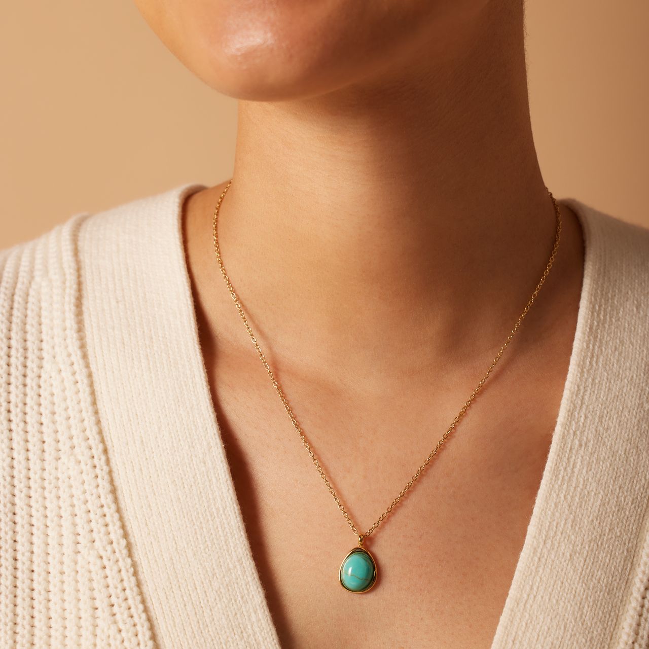 Stainless steel goldplated ketting met turquoise ovaal