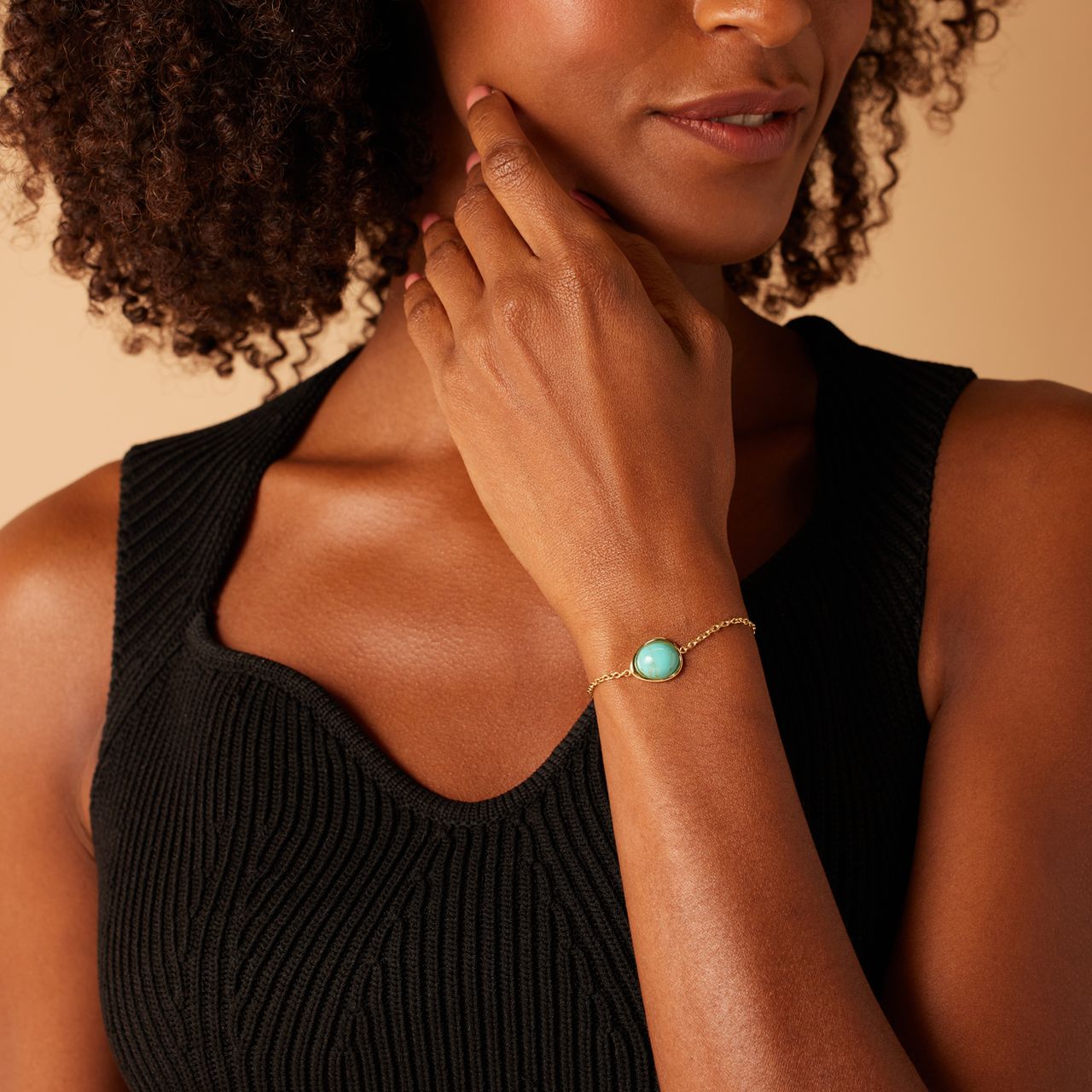 Stalen goldplated armband met turquoise ovaal