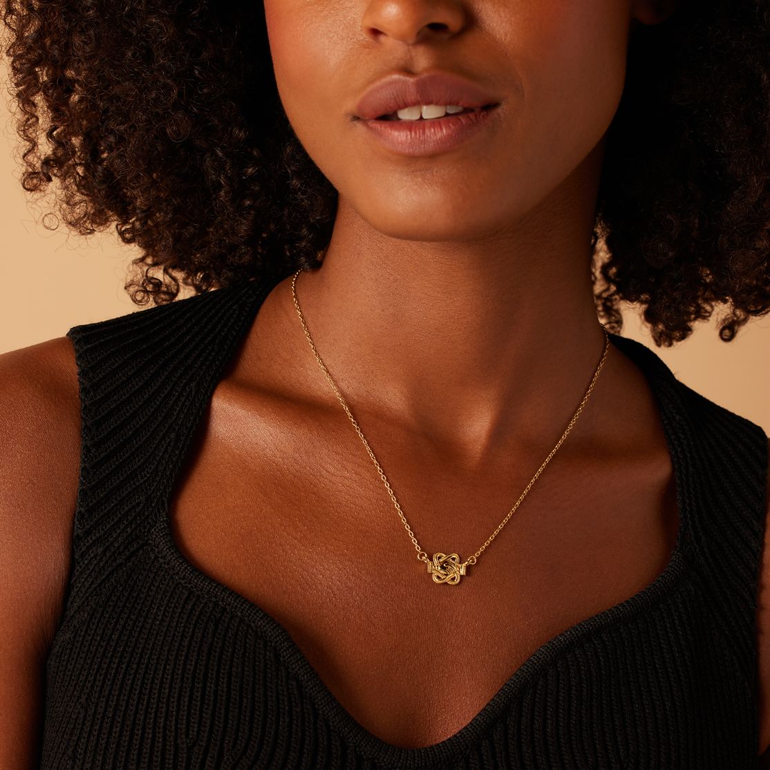 Stainless steel goldplated ketting met mattenklopper met hand