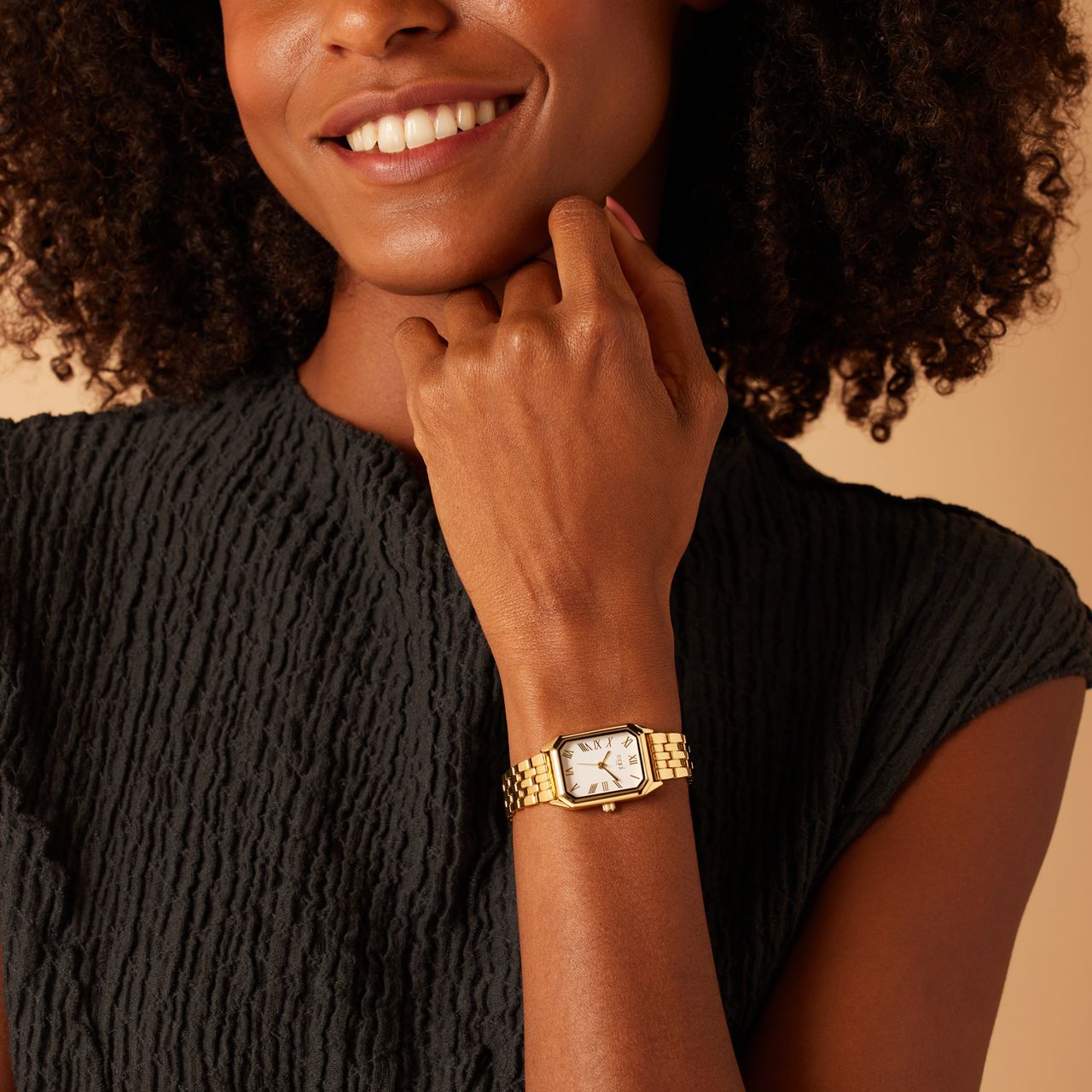 Regal Armbanduhr, goldfarben, mit römischen Ziffern