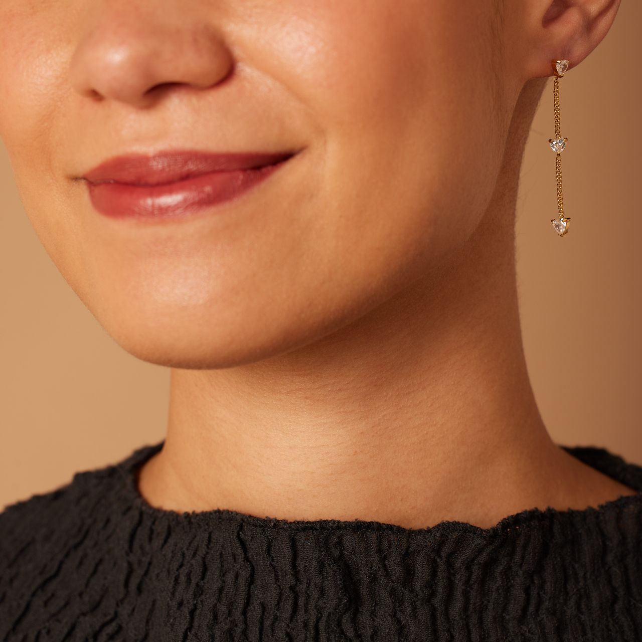 Stainless steel goldplated oorhangers met wit zirkonia hart voor dames