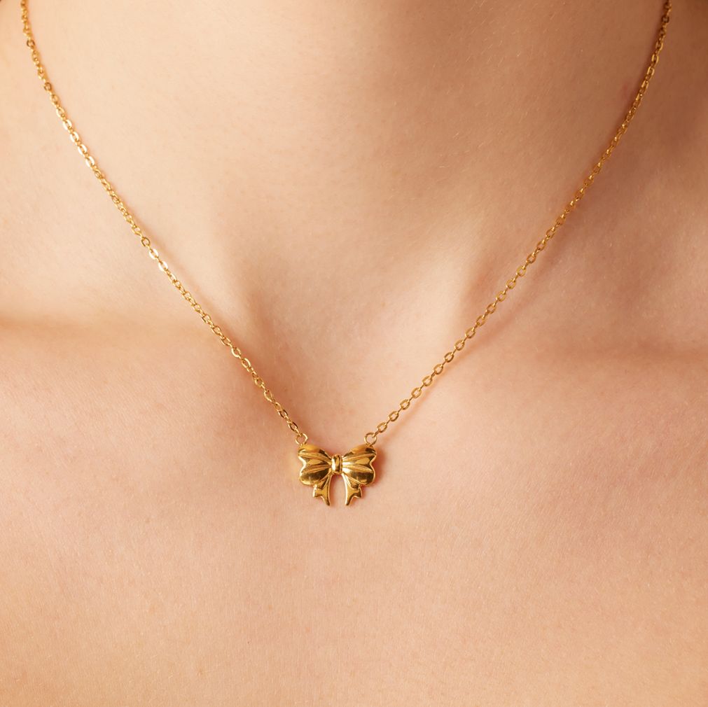 Stalen goldplated ketting met hanger strik voor dames