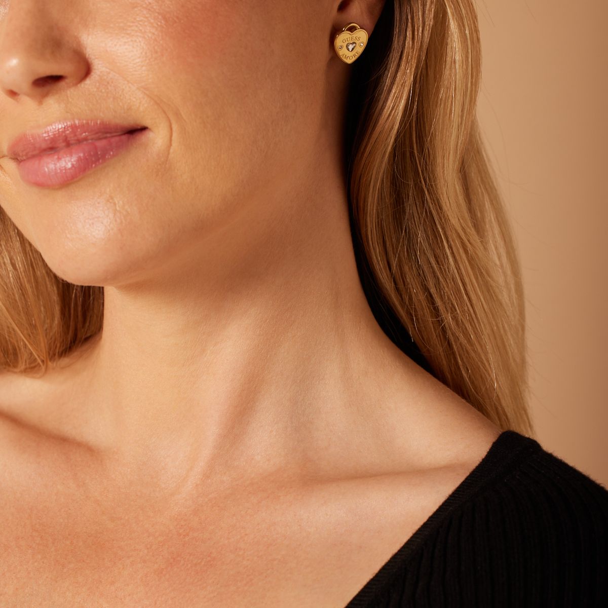 Guess stalen goldplated oorbellen AMORE