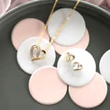 Diamond Luxury 14 karaat geelgouden oorknoppen hart met 4 diamanten voor dames