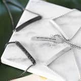 Gerecycled stainless steel plaatarmband never say never
