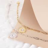Guess stainless steel goldplated schakelarmband met kristal voor dames