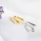 Zilveren rhodiumplated ovalen oorringen zirkonia voor dames
