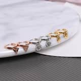 Guess stainless steel goldplated oorringen met hanger hart voor dames
