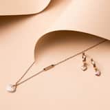 Guess stainless steel roséplated oorringen met hanger hart voor dames
