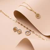 Guess stainless steel goldplated ketting hanger 4g logo voor dames