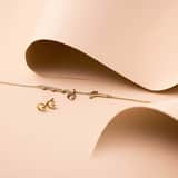 Guess stainless steel goldplated oorknoppen met kristal voor dames