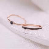 14 karaat rosegouden ring 7 zwarte diamanten 0,025ct bol