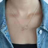 Goldfarbene Byoux-Kette mit Kreis/Dreieck