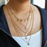 Bijoux goudkleurige ketting met hanger multi met muntjes voor dames