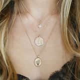 Bijoux goudkleurige ketting met hanger munt voor dames