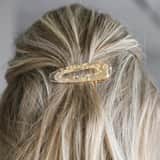 Doorzichtige haarclip met goudkleurige elementen voor dames