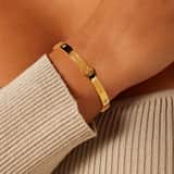 Guess stainless steel goldplated bangle 4G logo