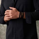 Gerecycled stalen armband zwart leer en goldplated sluiting