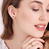 Zilveren goldplated oorknoppen infinity met zirkonia voor dames