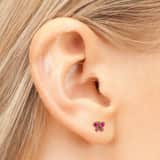 Studex 14 karaat geelgouden schietoorbel vlinder roze 4mm 439