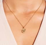 Stainless steel goldplated ketting met hanger surinaamse mattenklopper