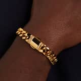 Stainless steel goldplated herenschakelarmband met zirkonia
