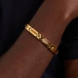 Stainless steel goldplated herenschakelarmband met zirkonia