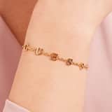 Guess stainless steel goldplated schakelarmband met kristal voor dames
