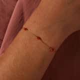 Stainless steel goldplated fantasiearmband met oranje stenen voor dames