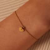 Stainless steel goldplated bedelarmband met hanger hart met zirkonia voor dames