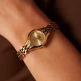Q&Q Damenarmbanduhr aus goldfarbenem Edelstahl F12A-001PY