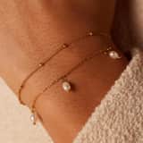 Stainless steel goldplated armbandenset met parel