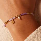 kralenarmband met parel en stainless steel goldplated ster