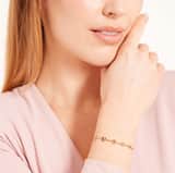 Guess stainless steel goldplated schakelarmband met kristal voor dames