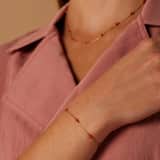 Stainless steel goldplated fantasiearmband met oranje stenen voor dames