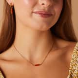 Stainless steel goldplated fantasiearmband met rode onyx voor dames