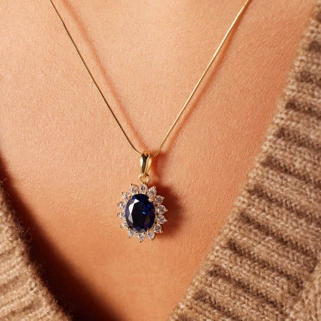 Zilveren goldplated ketting met hanger entourage blauw/wit
